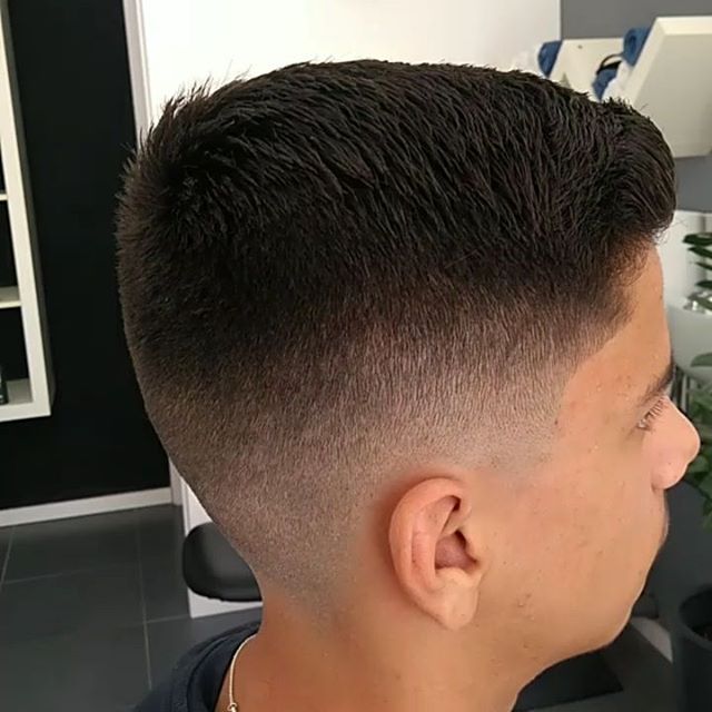 Clean low fade haircut side view — barber shop Larnaka
