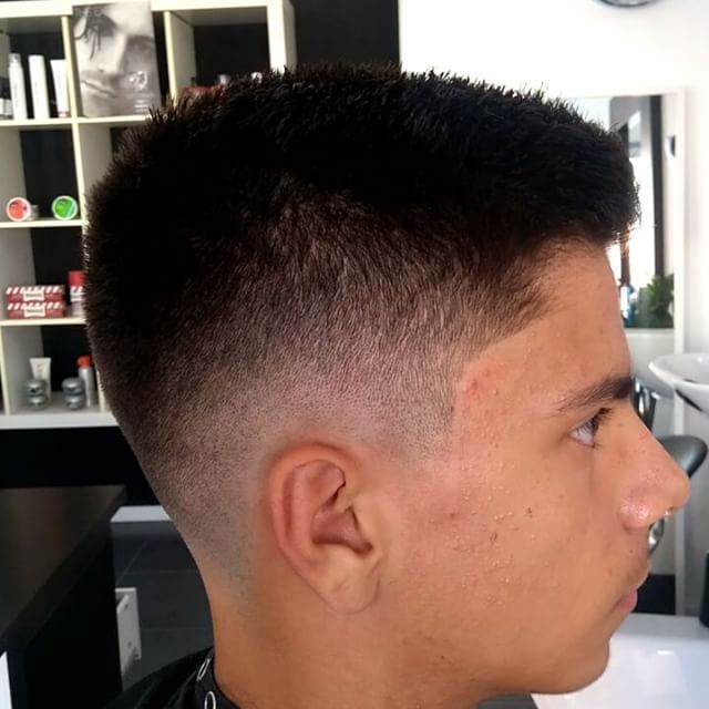 Low fade with textured top — premium barber Larnaka