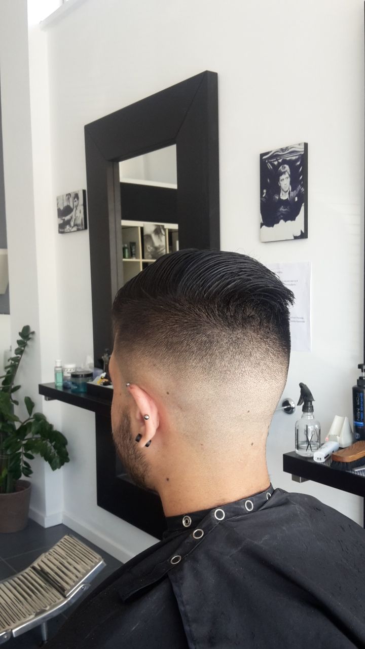 Precision slick-back fade at The Grooming Lounge barber shop in Larnaka